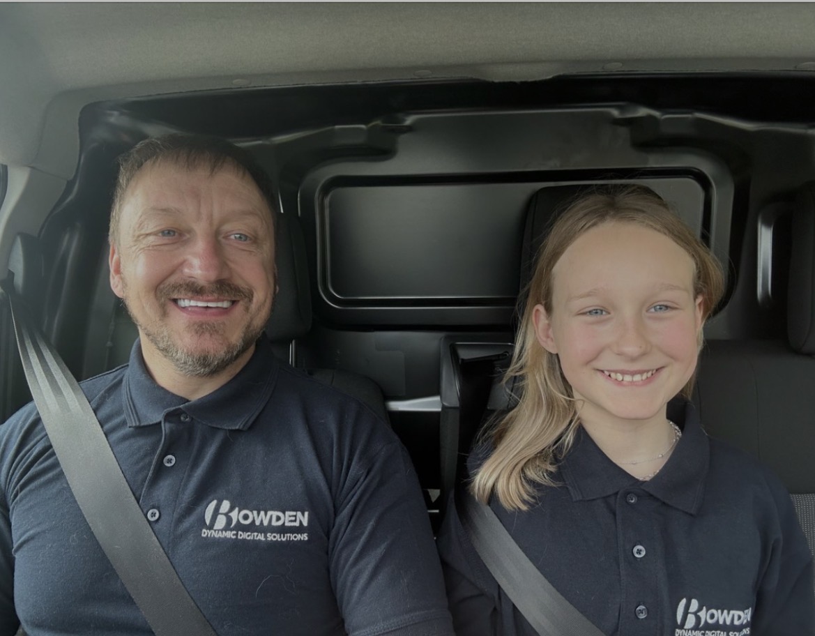 Kevin and his daughter in matching Bowden polo shirts, heading out on a service call together